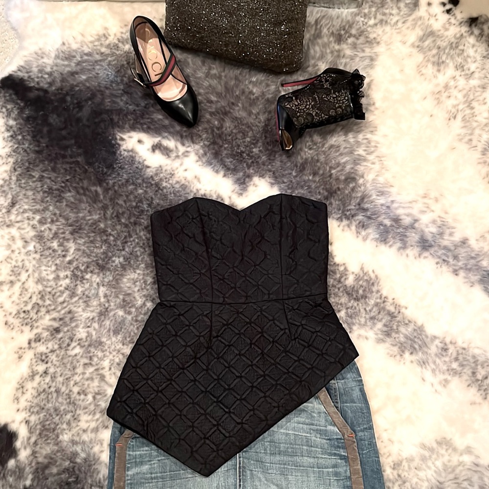 Black strapless corset top w/ asymmetric peplum detail, XS. Excellent condition!